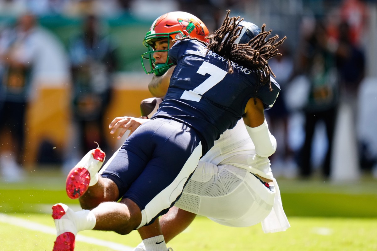 Sep 4, 2022; Miami, Florida, US; Jackson State Tigers safety Cam'Ron Silmon-Craig (7) sacks Florida A&M Rattlers quarterback Jeremy Moussa (8) during the first quarter at Hard Rock Stadium. Mandatory Credit: Rich Storry-USA TODAY Sports