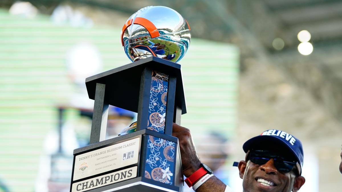 Sep 4, 2022; Miami, Florida, US; Jackson State Tigers head coach Deion Sanders receives the Orange Blossom Classic Trophy after beating Florida A&M Rattlers at Hard Rock Stadium.