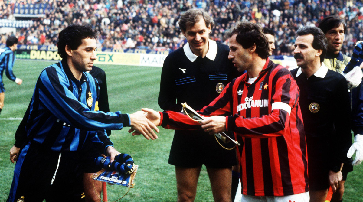 Giuseppe Baresi and Franco Baresi shake hands before a Milan derby.
