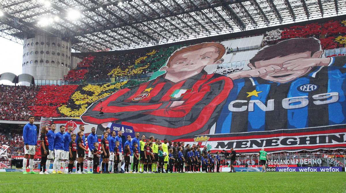 AC Milan fans unveil a tifo at the Milan derby.