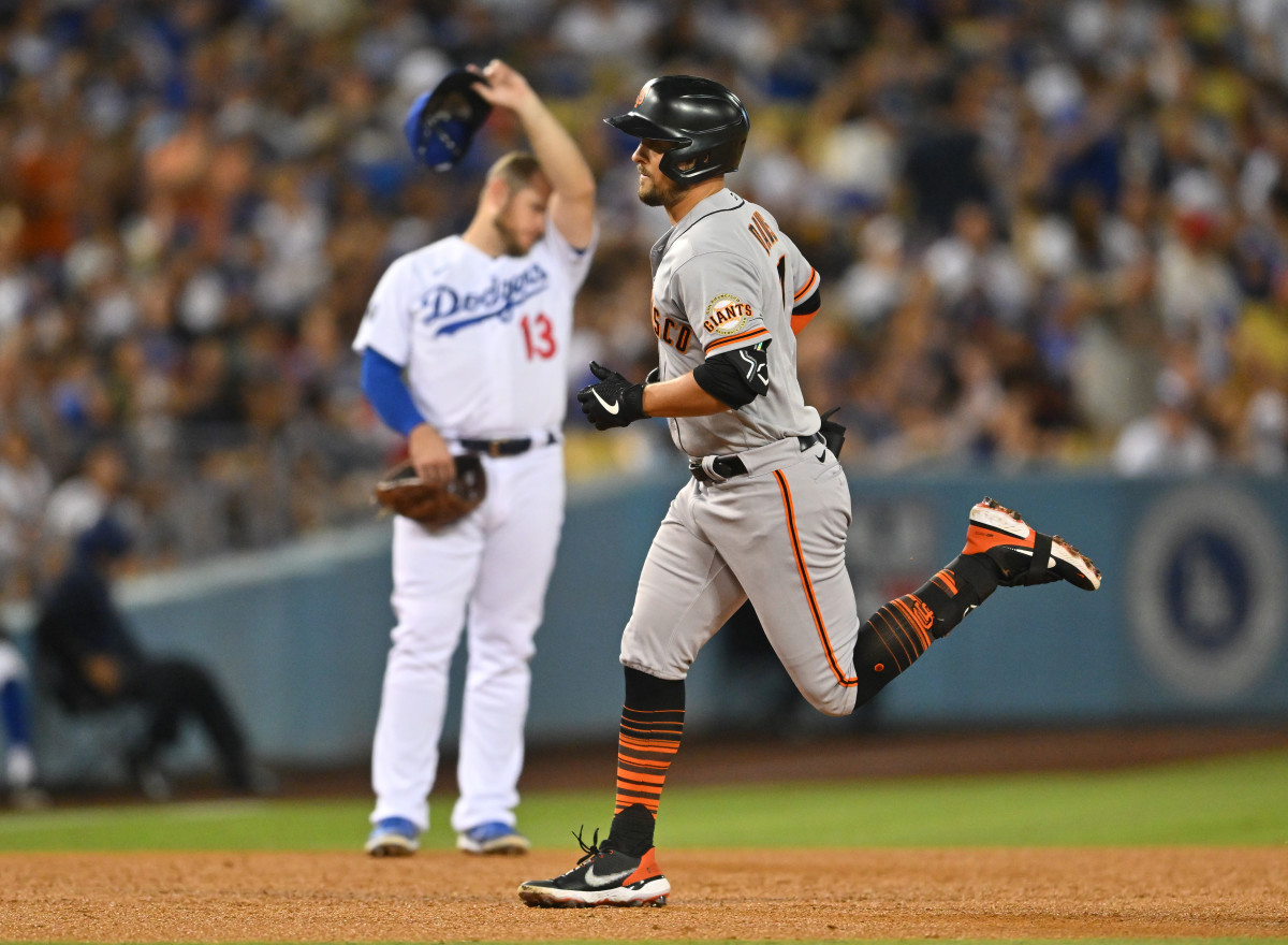 SF Giants infielder J.D. Davis jogs around the bases after hitting a home run against the Dodgers.