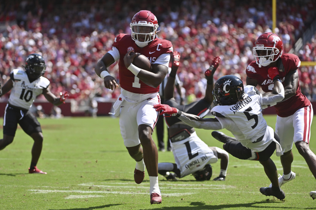 Arkansas quarterback KJ Jefferson (1) breaks through the Cincinnati defense to score a touchdown during an NCAA college football game Saturday, Sept. 3, 2022, in Fayetteville, Ark. (AP Photo/Michael Woods)