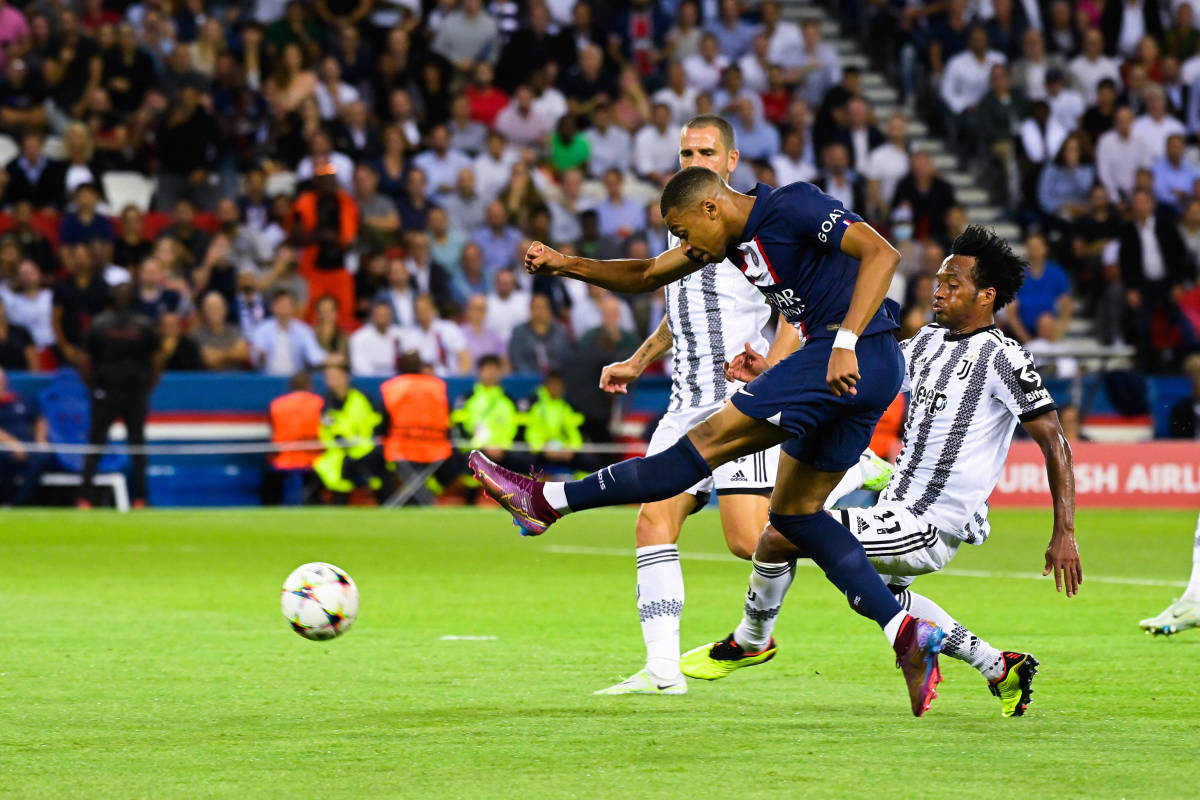 Kylian Mbappe pictured volleying the ball to score for PSG against Juventus in the Champions League in September 2022