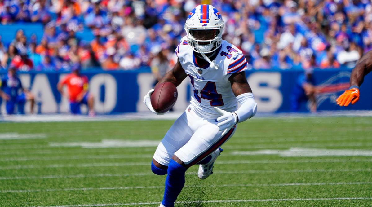 Aug 20, 2022; Orchard Park, New York, USA; Buffalo Bills wide receiver Stefon Diggs (14) runs with the ball after making a catch against the Denver Broncos during the first half at Highmark Stadium.