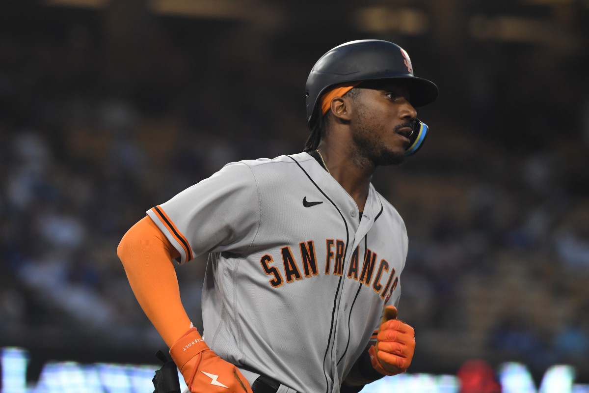 SF Giants outfielder Lewis Brinson runs the bases after hitting a home run.