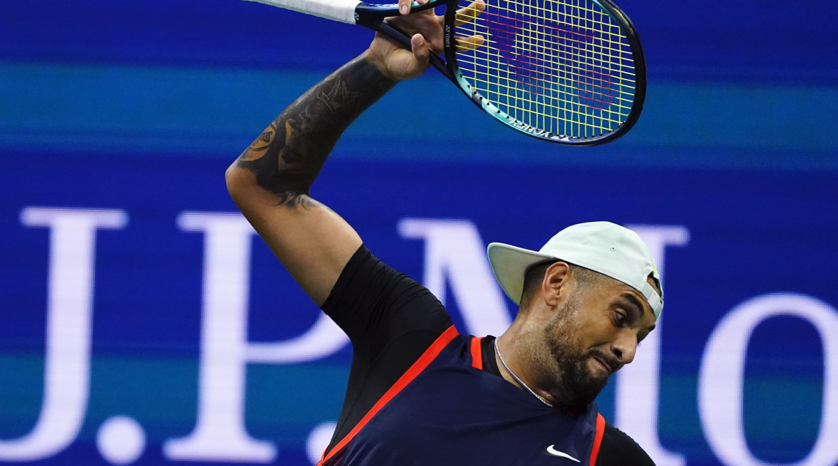 Nick Kyrgios, of Australia, tosses his racket as he plays Karen Khachanov, of Russia, during the quarterfinals of the U.S. Open tennis championships, Tuesday, Sept. 6, 2022, in New York.