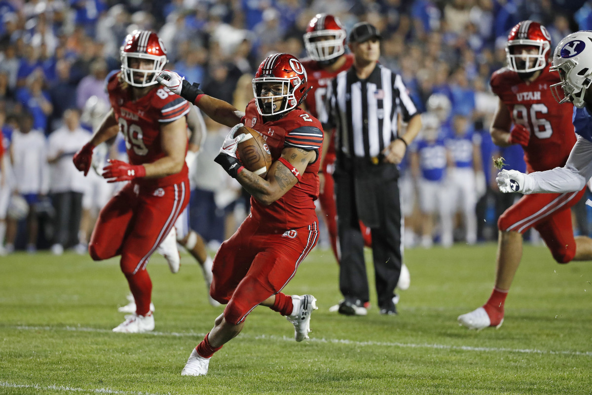 Utah Utes running back Micah Bernard (2) runs for a fourth quarter touchdown against the Brigham Young Cougars at LaVell Edwards Stadium.