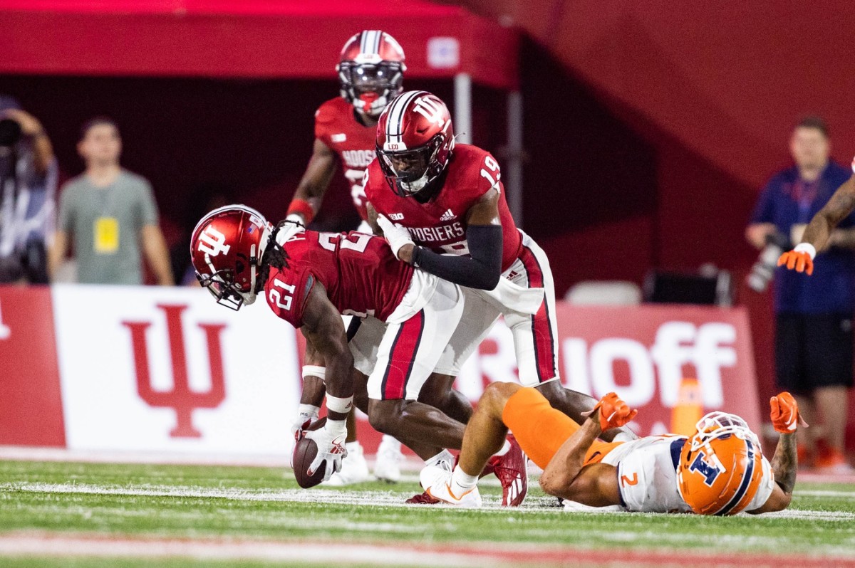 Indiana Hoosiers defensive back Noah Pierre (21) picks up the fumble by Illinois Fighting Illini running back Chase Brown (2) in the second half at Memorial Stadium.