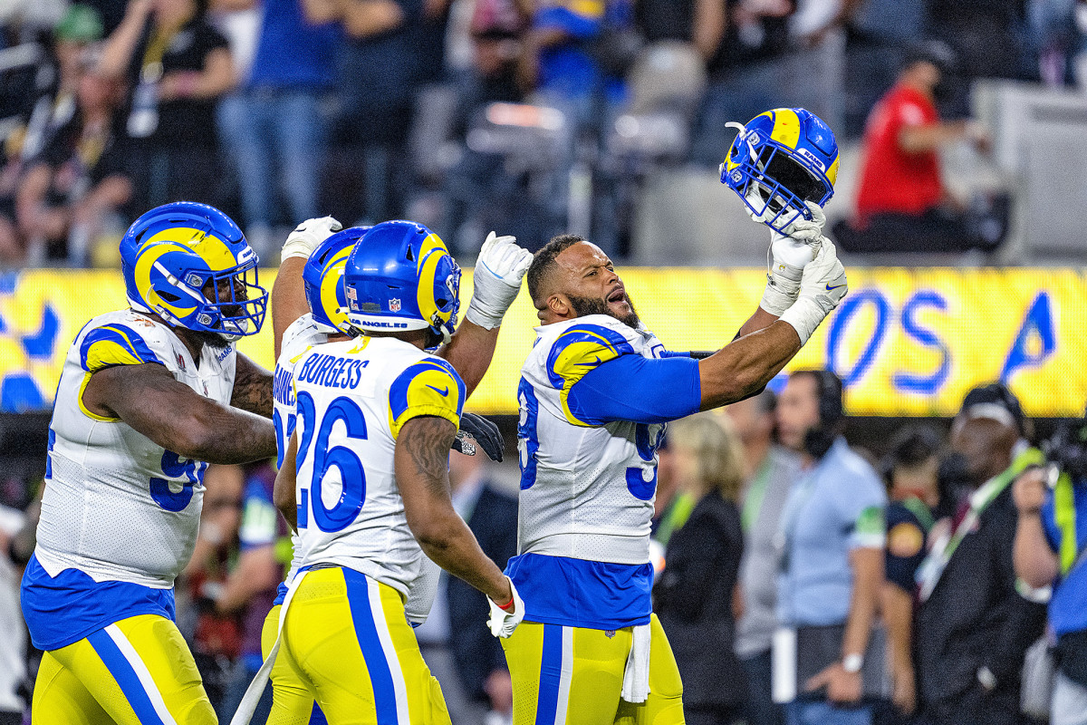 Rams defensive tackle Aaron Donald point to his ring finger after winning the Super Bowl.