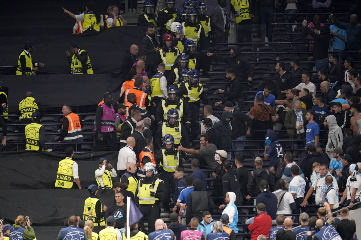 Riot police pictured creating a wall between Tottenham and Marseille fans at Tottenham Hotspur Stadium after a Champions League match in September 2022