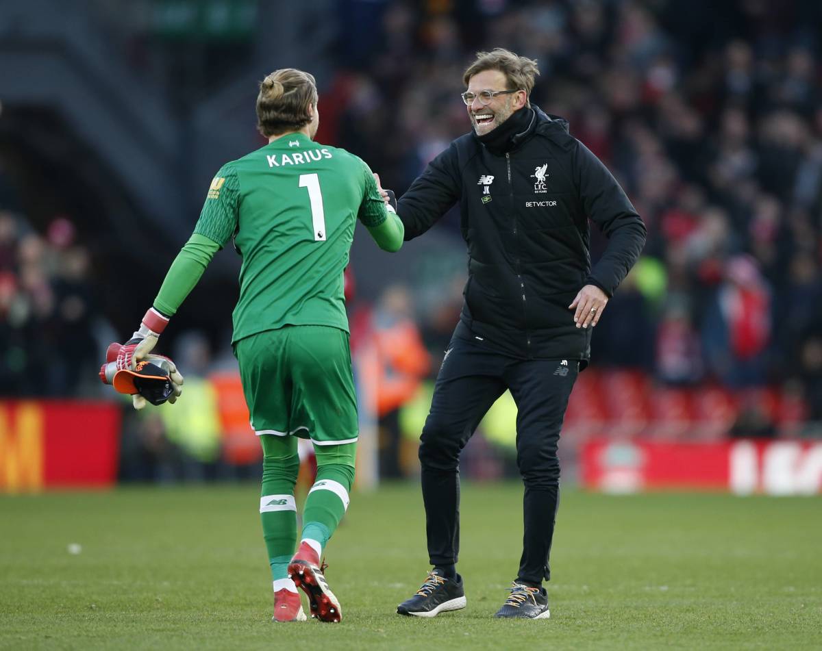 Loris Karius pictured celebrating with Jurgen Klopp (right) after Liverpool beat Southampton 2-0 in February 2018