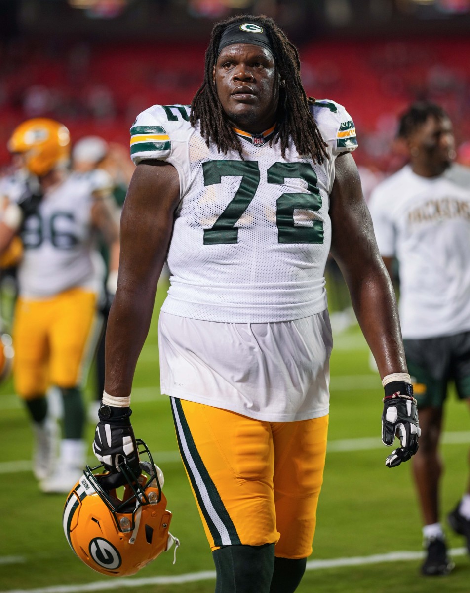 Green Bay Packers offensive tackle Caleb Jones (72) leaves the field after a game against the Kansas City Chiefs at GEHA Field at Arrowhead Stadium.
