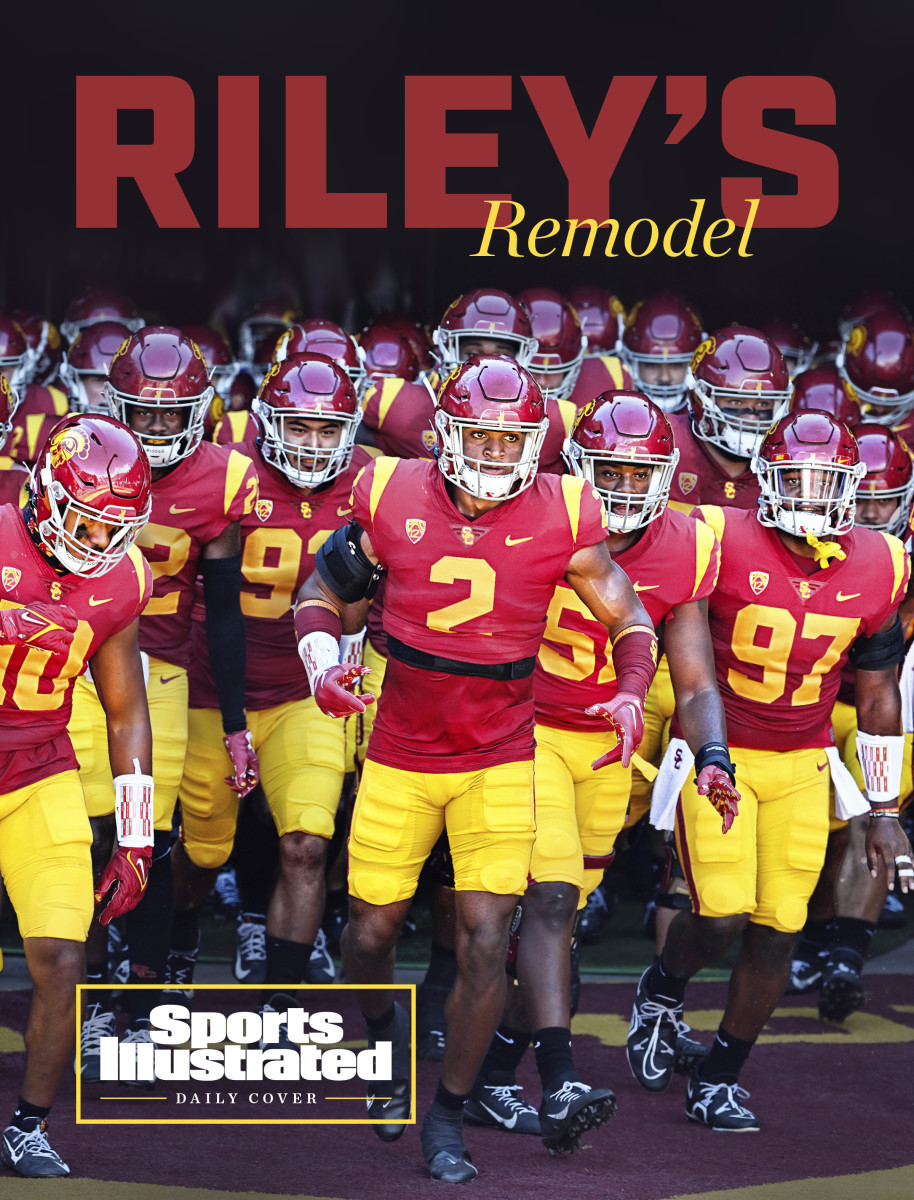 USC players run out onto the field ahead of a game against Rice.