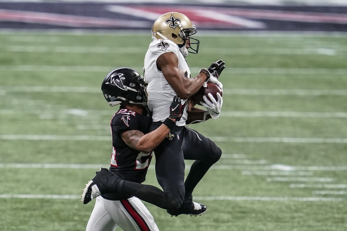 Dec 6, 2020; New Orleans Saints receiver Michael Thomas (13) catches a pass over Atlanta Falcons cornerback A.J. Terrell (24). Mandatory Credit: Dale Zanine-USA TODAY Sports