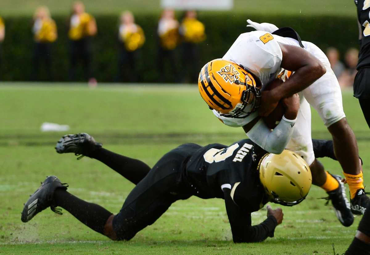 Wofford College played Kennesaw State University in college football on Sept. 18, 2021. Wofford Jaheem Hazel (3) takes down Kennesaw State's QB Xavier Shepherd (8) on the play. Shj Wofford Kennesaw Football11