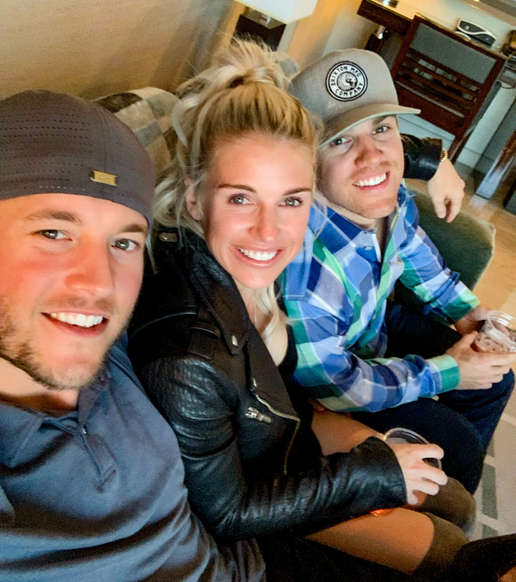 Matthew Stafford, Kelly Stafford, and Chad Hall pose for a selfie on a couch