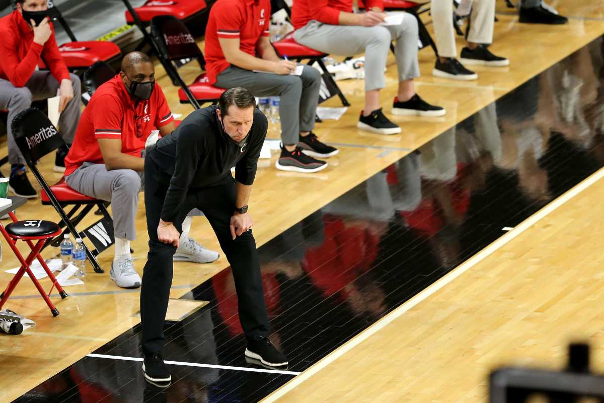 Cincinnati Bearcats head coach John Brannen observes the team in the first half of a men's NCAA basketball game against the Tulane Green Wave, Friday, Feb. 26, 2021, at Fifth Third Arena in Cincinnati. Tulane Green Wave At Cincinnati Bearcats Feb 26