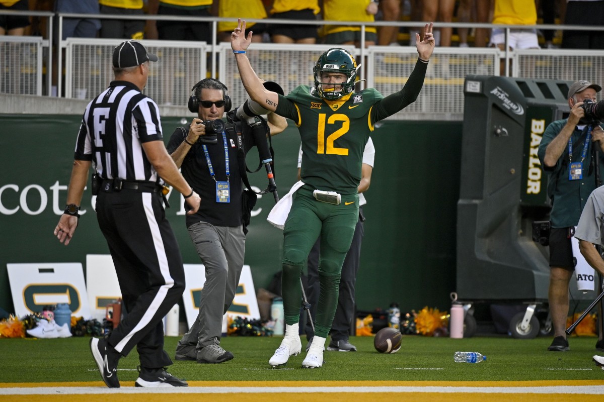 Sep 3, 2022; Waco, Texas, USA; Baylor Bears quarterback Blake Shapen (12) celebrates scoring a touchdown against the Albany Great Danes during the second quarter at McLane Stadium.