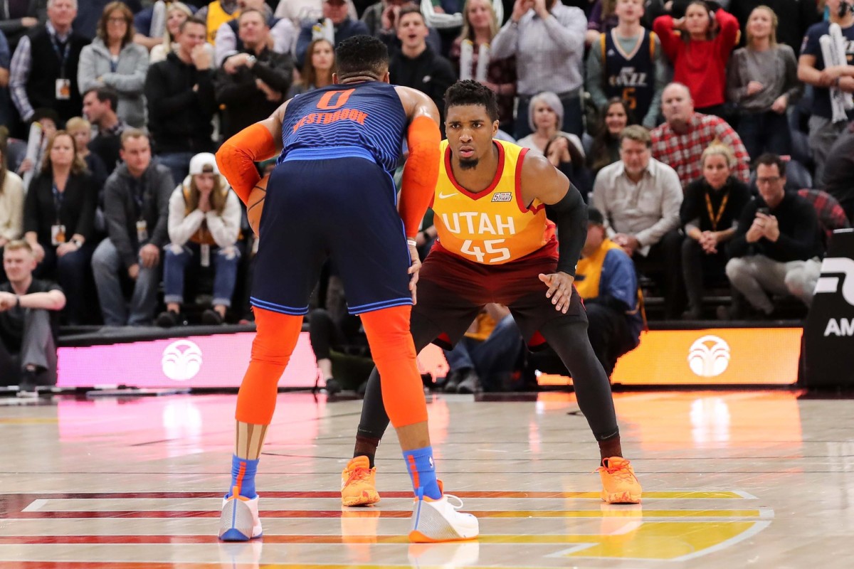 Utah Jazz guard Donovan Mitchell (45) guards Oklahoma City Thunder guard Russell Westbrook (0) during the final moments of the fourth quarter at Vivint Smart Home Arena. Oklahoma City Thunder won 107-106.