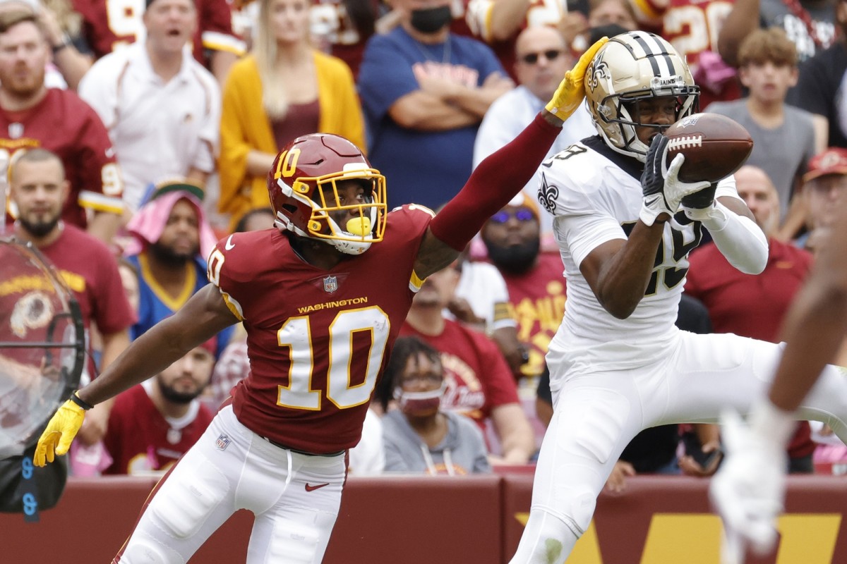 Oct 10, 2021; Saints cornerback Paulson Adebo (29) intercepts a pass intended for Washington receiver Curtis Samuel (10. Mandatory Credit: Geoff Burke-USA TODAY