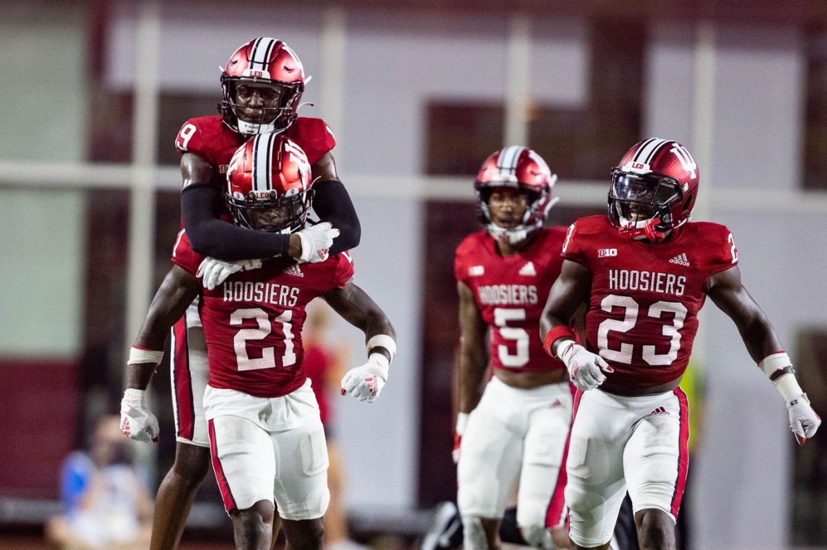 Indiana Hoosiers defensive back Noah Pierre (21) celebrates his fumble recovery with teammates in the second half against the Illinois Fighting Illini at Memorial Stadium.