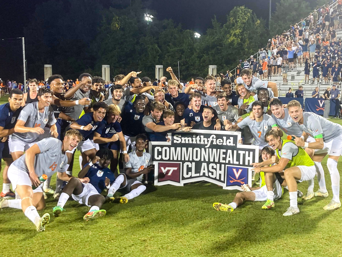 The Virginia men's soccer team celebrates after defeating Virginia Tech in the Commonwealth Clash.