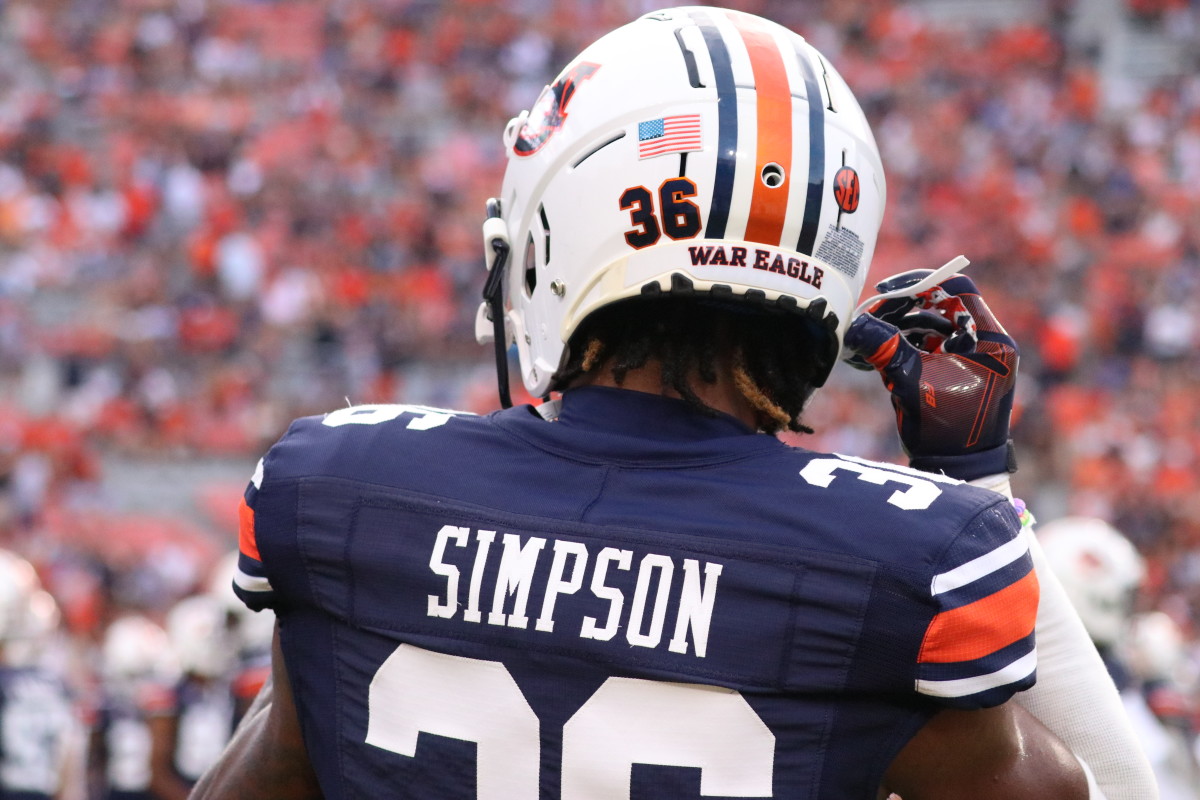 Jaylin Simpson straps up his helmet in preparation for Auburn vs San Jose State.