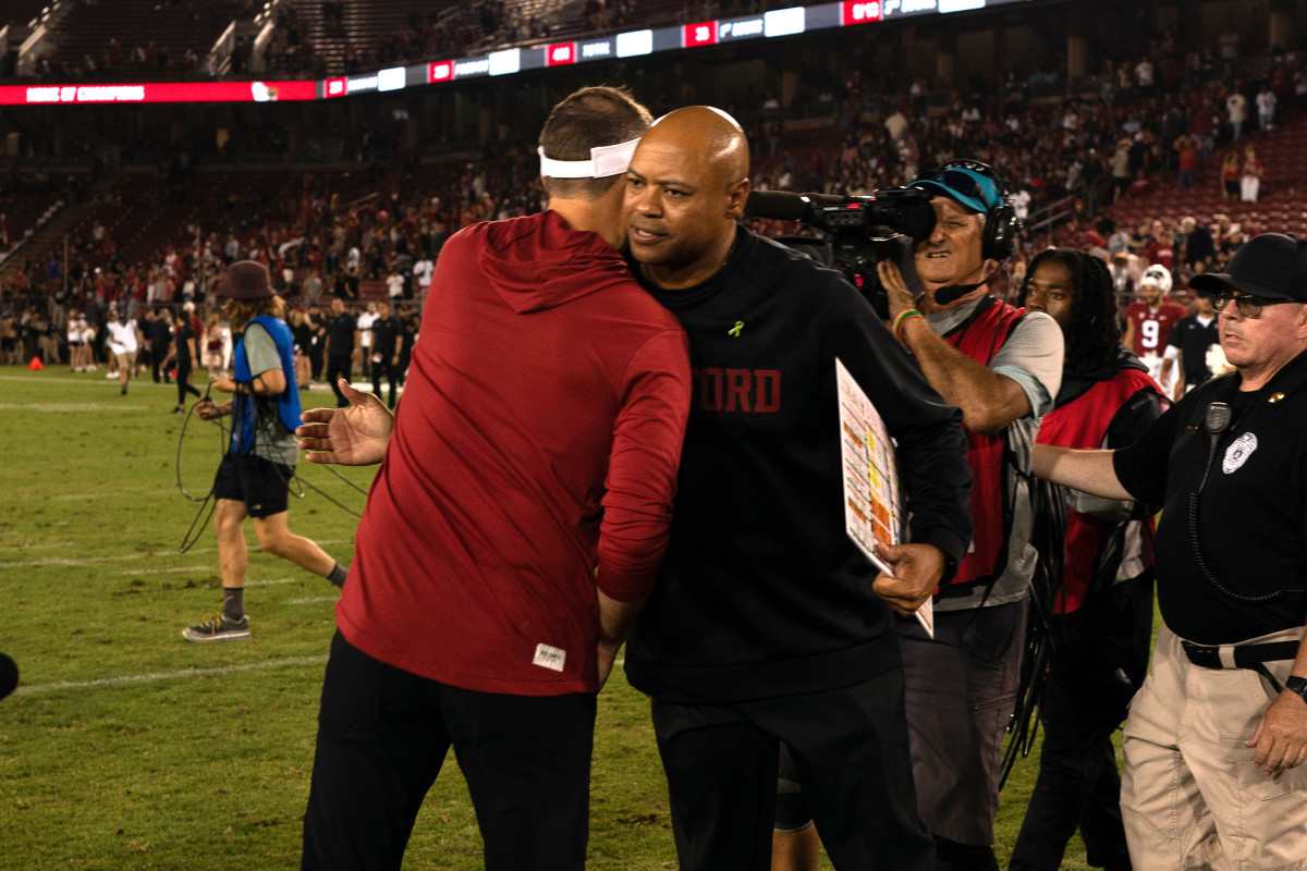USC Trojans head coach Lincoln Riley (left) shakes hands with Stanford Cardinal head coach David Shaw after a game at Stanford Stadium.