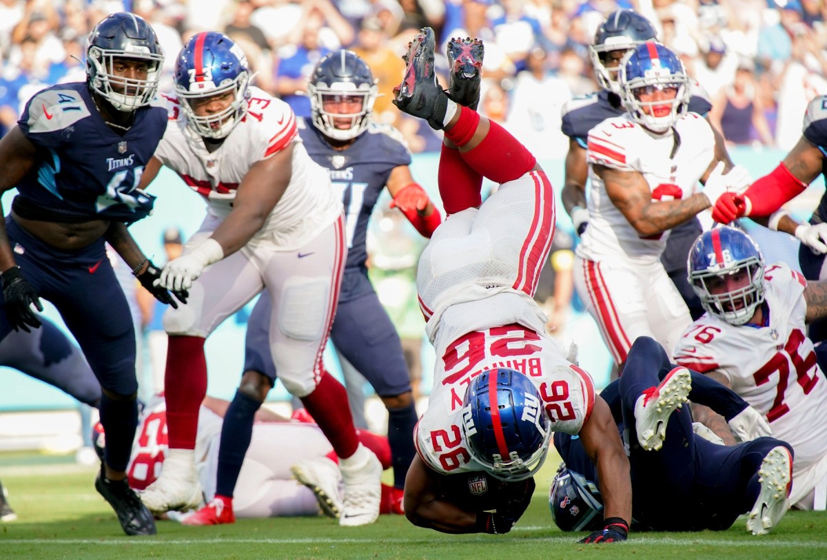 New York Giants running back Saquon Barkley (26) scores a touchdown during the third quarter at Nissan Stadium Sunday, Sept. 11, 2022, in Nashville, Tenn.