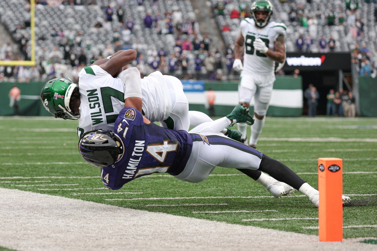 New York Jets WR Garrett Wilson tackled by Baltimore Ravens defender