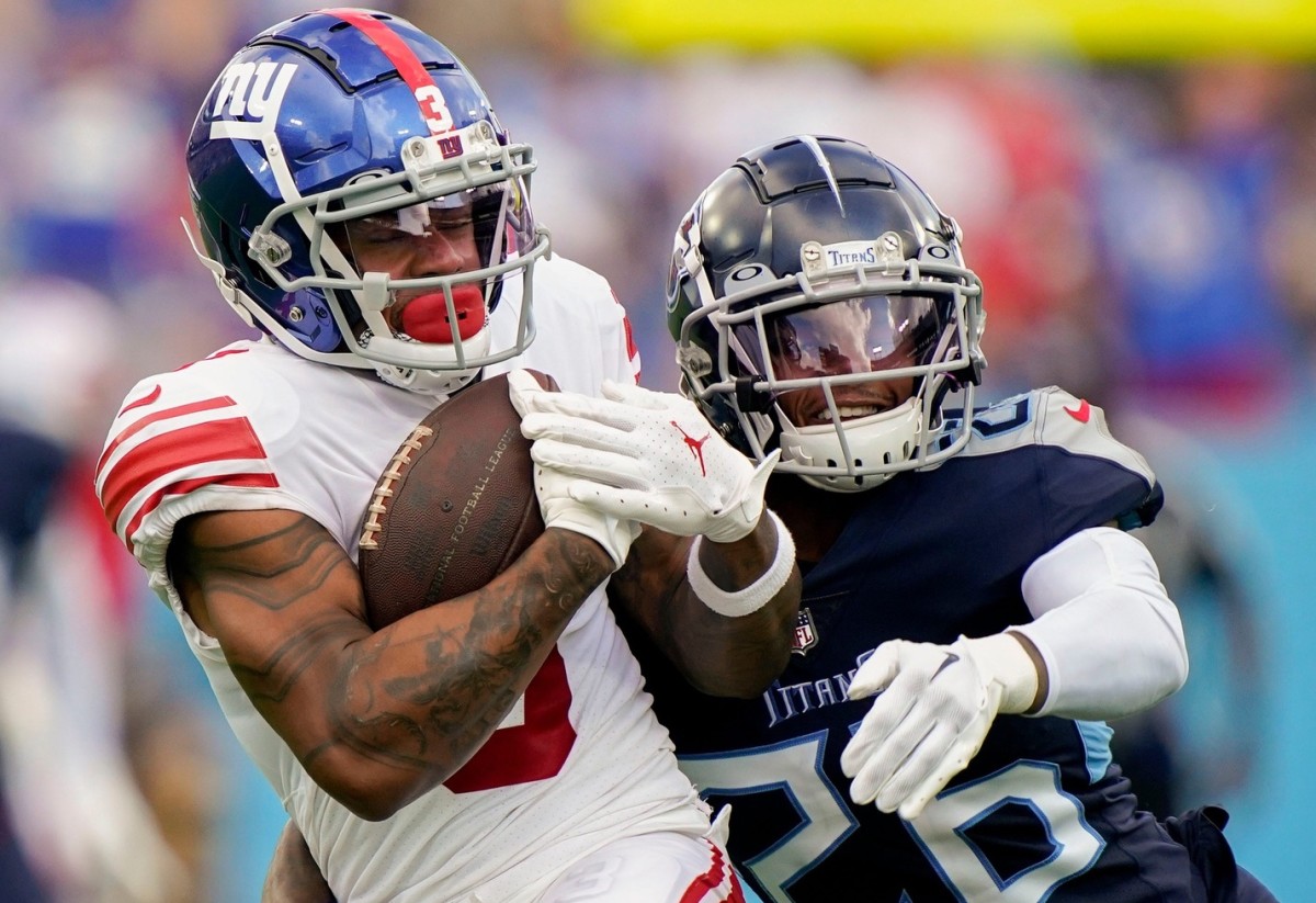 New York Giants wide receiver Sterling Shepard (3) pulls in a touchdown catch under pressure from Tennessee Titans cornerback Kristian Fulton (26) during the third quarter at Nissan Stadium Sunday, Sept. 11, 2022, in Nashville, Tenn.