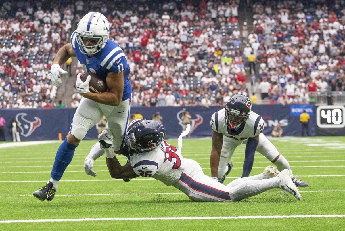 Sep 11, 2022; Houston, Texas, USA; Indianapolis Colts wide receiver Michael Pittman Jr. (11) scores a touchdown against Houston Texans Houston Texans safety Jonathan Owens (36) in the fourth quarter at NRG Stadium.