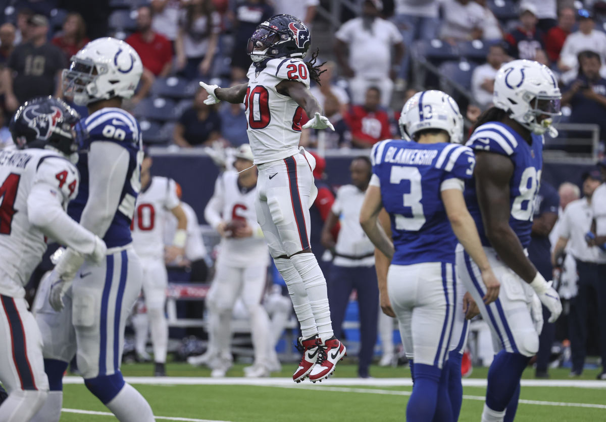 Sep 11, 2022; Houston, Texas, USA; Houston Texans cornerback Isaac Yiadom (20) leaps after Indianapolis Colts place kicker Rodrigo Blankenship (3) misses a field goal attempt during overtime at NRG Stadium.