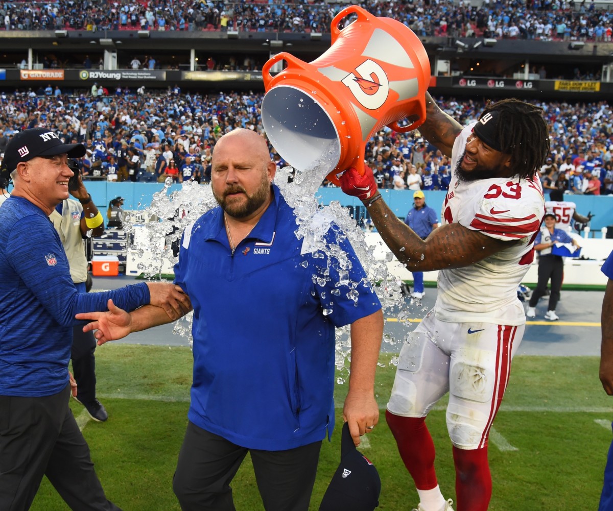 Sep 11, 2022; Nashville, Tennessee, USA; New York Giants head coach Brian Daboll receives a Gatorade bath from linebacker Oshane Ximines (53) after a win against the Tennessee Titans at Nissan Stadium.