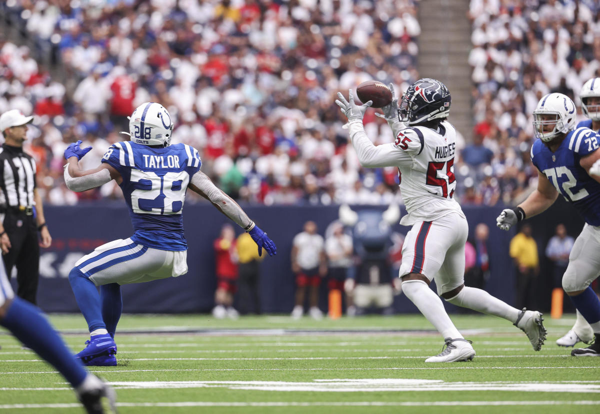 Sep 11, 2022; Houston, Texas, USA; A pass intended for Indianapolis Colts running back Jonathan Taylor (28) is intercepted by Houston Texans defensive end Jerry Hughes (55) during the second quarter at NRG Stadium. Mandatory Credit: Troy Taormina-USA TODAY Sports