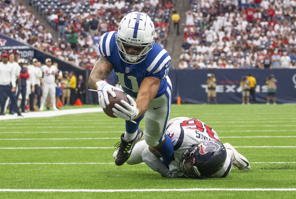 Sep 11, 2022; Houston, Texas, USA; Indianapolis Colts wide receiver Michael Pittman Jr. (11) scores a touchdown against Houston Texans Houston Texans safety Jonathan Owens (36) in the fourth quarter at NRG Stadium. Mandatory Credit: Thomas Shea-USA TODAY Sports