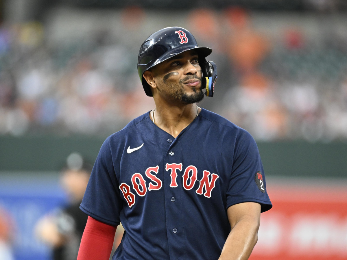 Red Sox shortstop Xander Bogaerts looks out to the crowd as he walks back to the dugout.