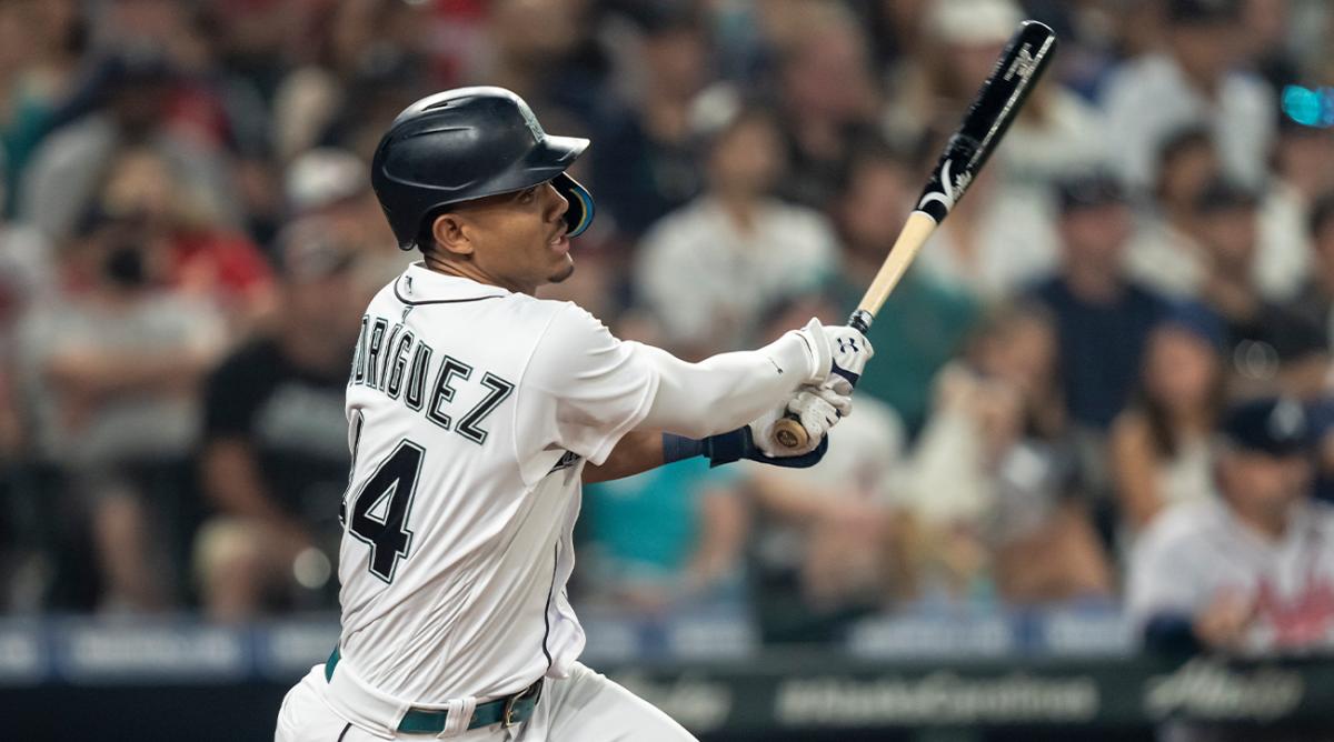 Sep 10, 2022; Seattle, Washington, USA; Seattle Mariners centerfielder Julio Rodriguez (44) hits a RBI double off Atlanta Braves relief pitcher Jesse Chavez (60) during the seventh inning at T-Mobile Park.