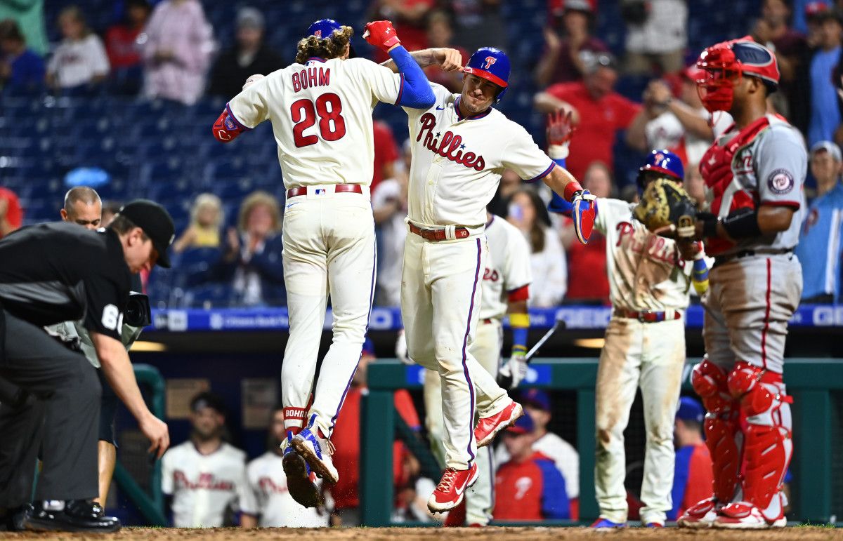 Alec Bohm celebrates with teammate J.T. Realmuto.