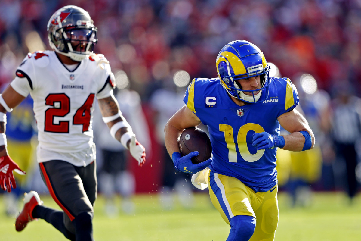 Jan 23, 2022; Tampa, Florida, USA; Los Angeles Rams wide receiver Cooper Kupp (10) runs the ball against Tampa Bay Buccaneers cornerback Carlton Davis (24) during the first half in a NFC Divisional playoff football game at Raymond James Stadium. Mandatory Credit: Nathan Ray Seebeck-USA TODAY Sports