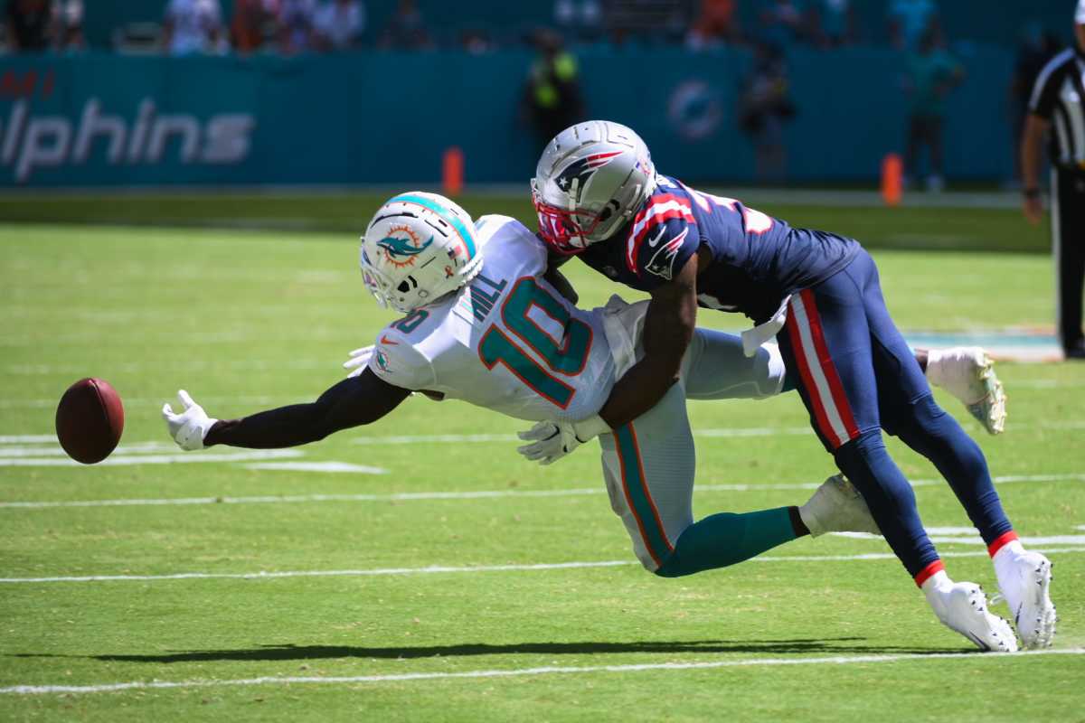 New England Patriots cornerback Jonathan Jones (31) breaks up a pass intended for Miami Dolphins wide receiver Tyreek Hill (10) during the game between the New England Patriots and host Miami Dolphins at Hard Rock Stadium in Miami Gardens, FL, on Sunday, September 11, 2022. Final score, Dolphins, 20, Patriots, 7. Dolphins V Patriots Nfl Game 56