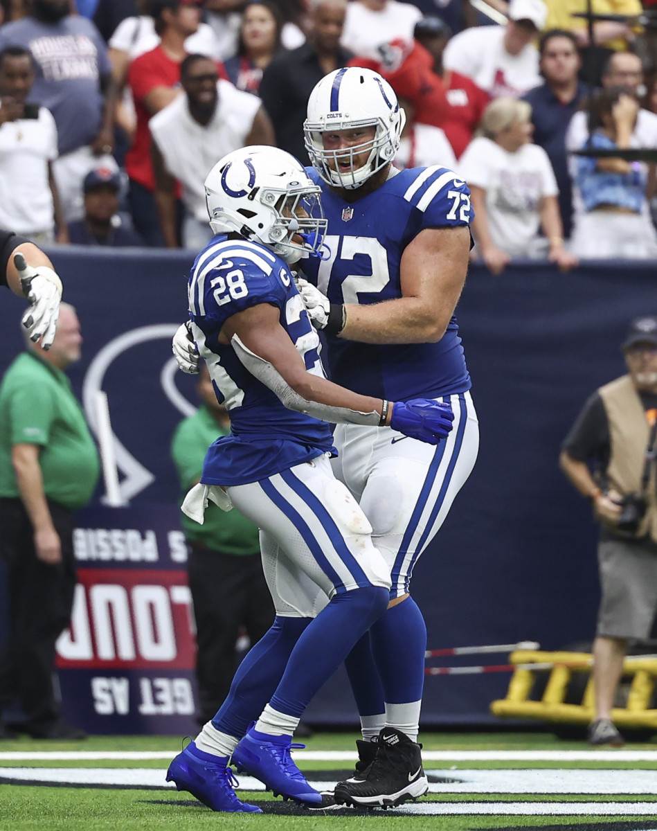 Sep 11, 2022; Houston, Texas, USA; Indianapolis Colts running back Jonathan Taylor (28) and offensive tackle Braden Smith (72) celebrate after a touchdown during the fourth quarter against the Houston Texans at NRG Stadium. Mandatory Credit: Troy Taormina-USA TODAY Sports
