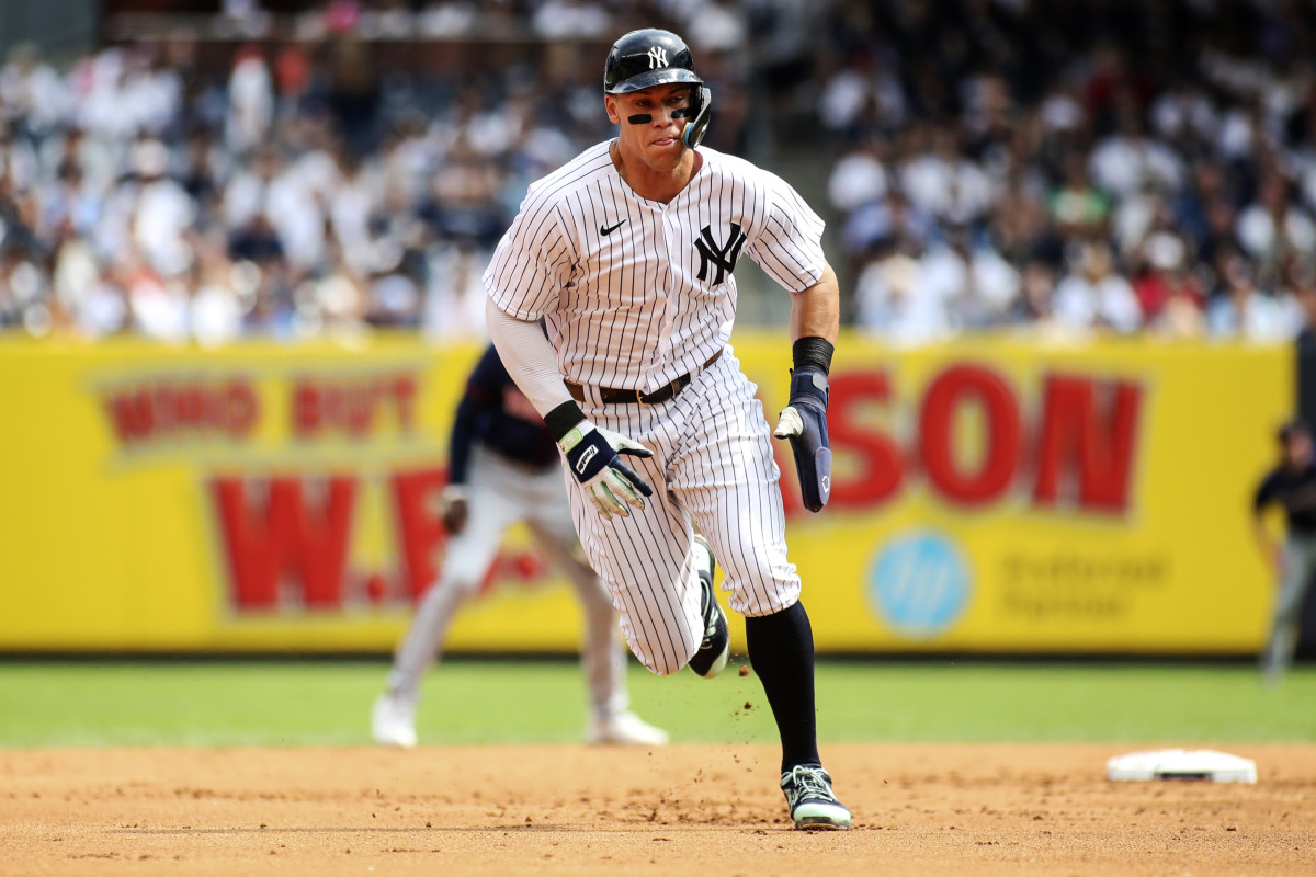 Sep 5, 2022; Bronx, New York, USA;  New York Yankees center fielder Aaron Judge (99) runs home to score the first run of the game in the first inning against the Minnesota Twins at Yankee Stadium.