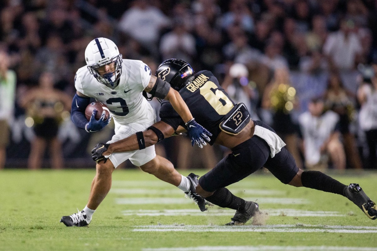 Sep 1, 2022; West Lafayette, Indiana, USA; Penn State Nittany Lions wide receiver Parker Washington (3) runs with the ball while Purdue Boilermakers linebacker Jalen Graham (6) defends in the second quarter at Ross-Ade Stadium.