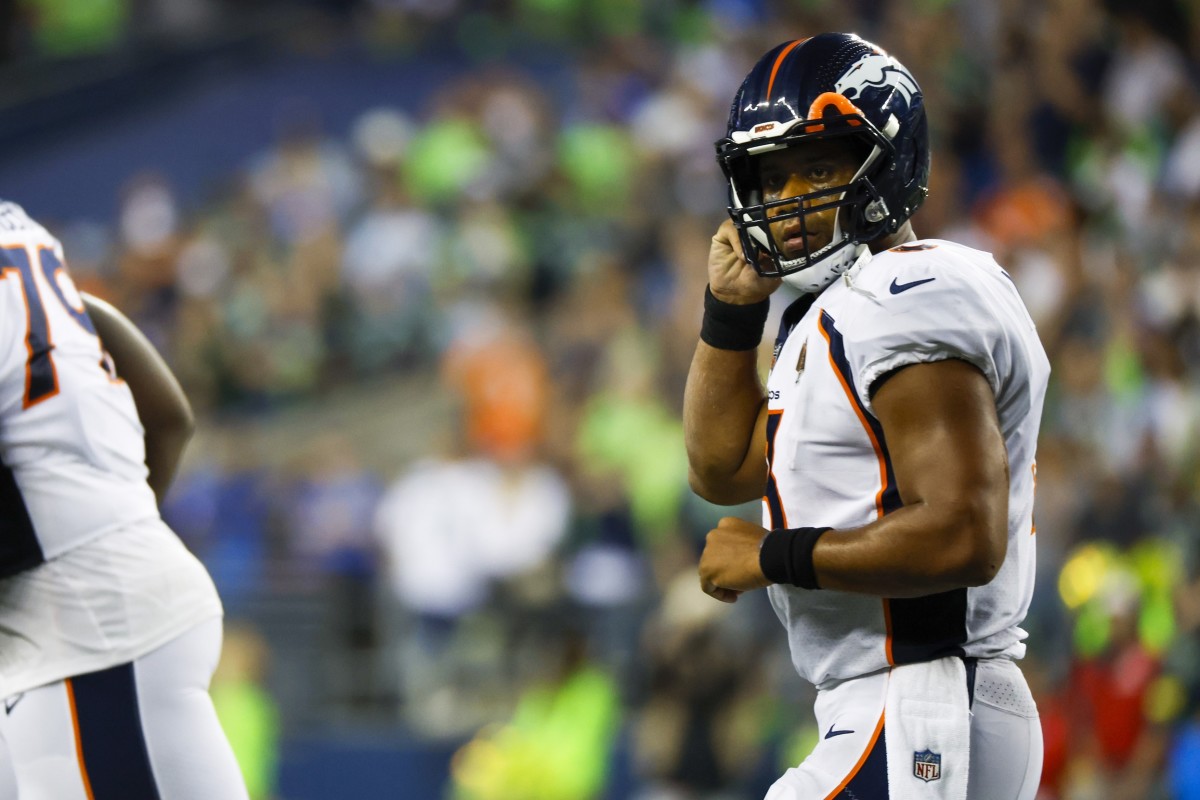 Denver Broncos quarterback Russell Wilson (3) returns to the sideline following a third down stop against the Seattle Seahawks during the fourth quarter at Lumen Field.