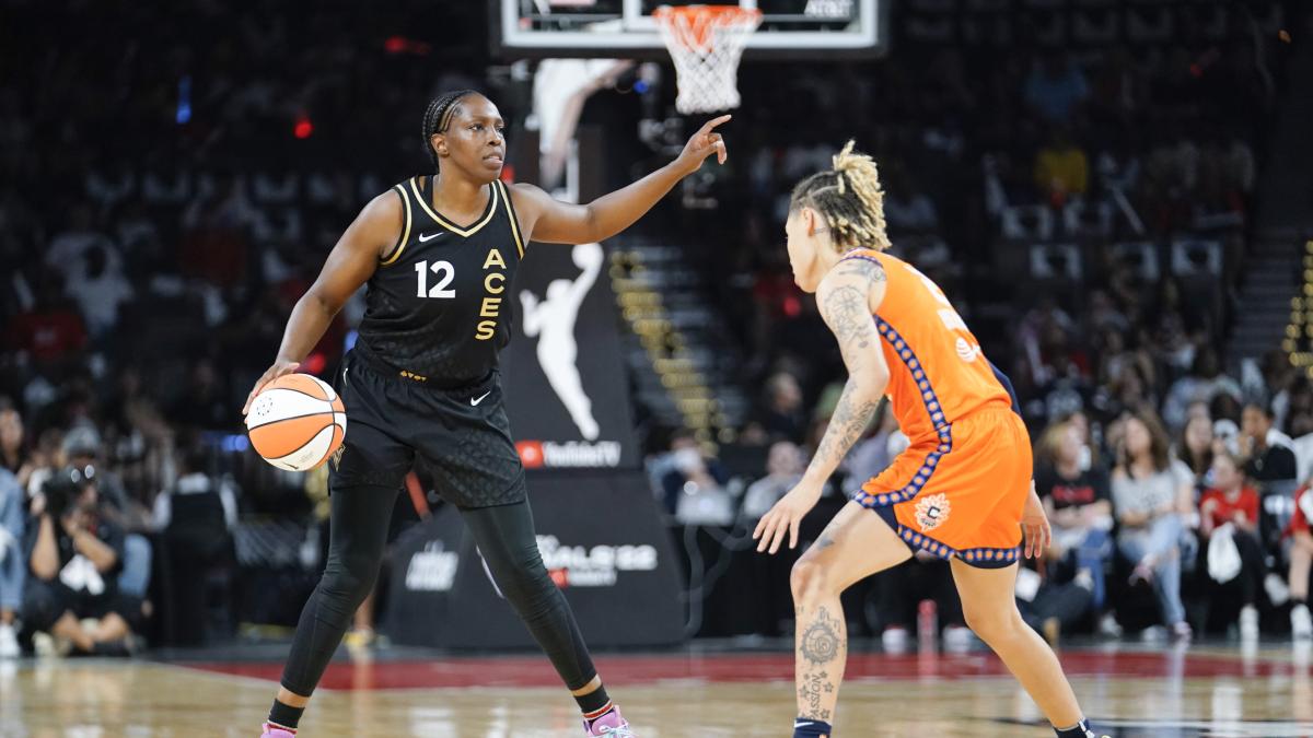 Aces guard Chelsea Gray controls the ball against Sun guard Natisha Hiedeman during the second quarter in Game 1 of the 2022 WNBA Finals.