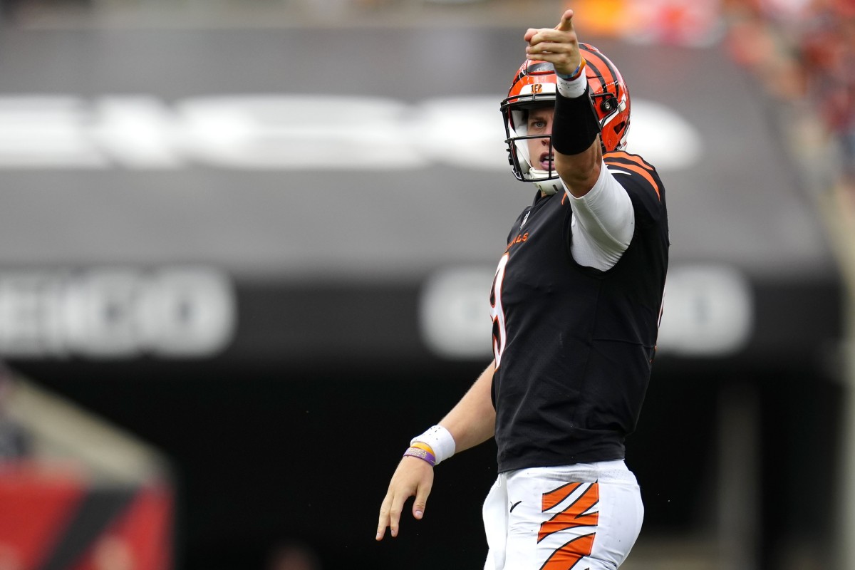Sep 11, 2022; Cincinnati, Ohio, USA; Cincinnati Bengals quarterback Joe Burrow (9) signals a first down after running for a first down during the fourth quarter of a Week 1 NFL football game against the Pittsburgh Steelers at Paycor Stadium. Mandatory Credit: Sam Greene-USA TODAY Sports