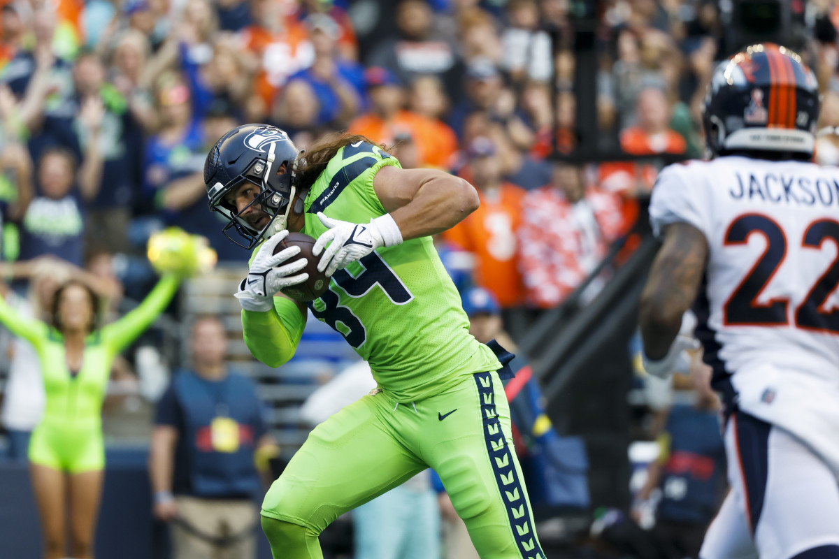 Seattle Seahawks tight end Colby Parkinson (84) catches a touchdown pass against the Denver Broncos during the second quarter at Lumen Field.