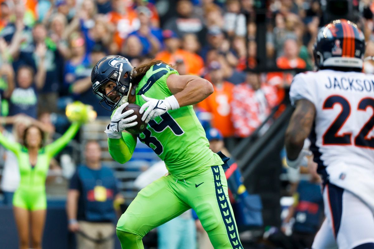 Seattle Seahawks tight end Colby Parkinson (84) catches a touchdown pass against the Denver Broncos during the second quarter at Lumen Field.