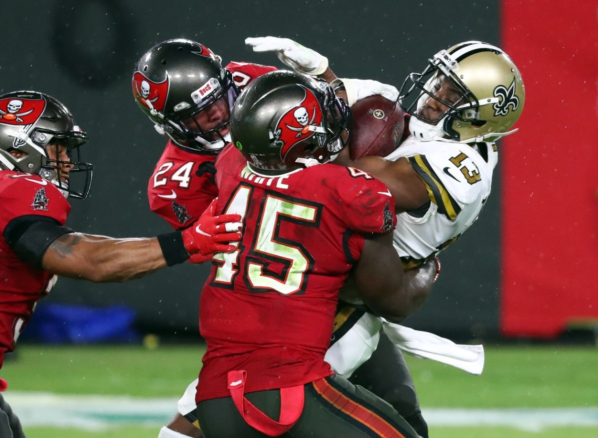 Nov 8, 2020; New Orleans Saints receiver Michael Thomas (13) catches the ball as Tampa Bay Buccaneers linebacker Devin White (45) defends. Mandatory Credit: Kim Klement-USA TODAY Sports